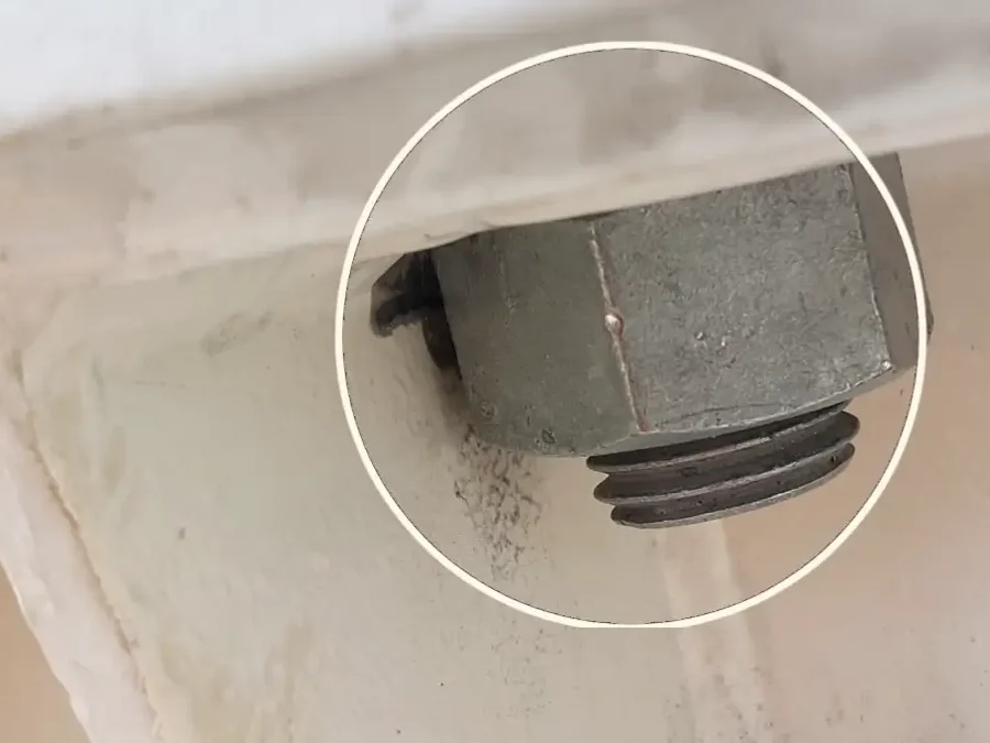 Motor-Base-Bolt-Clearance-01 Motor mounting bolts with restricted clearance during laser alignment.