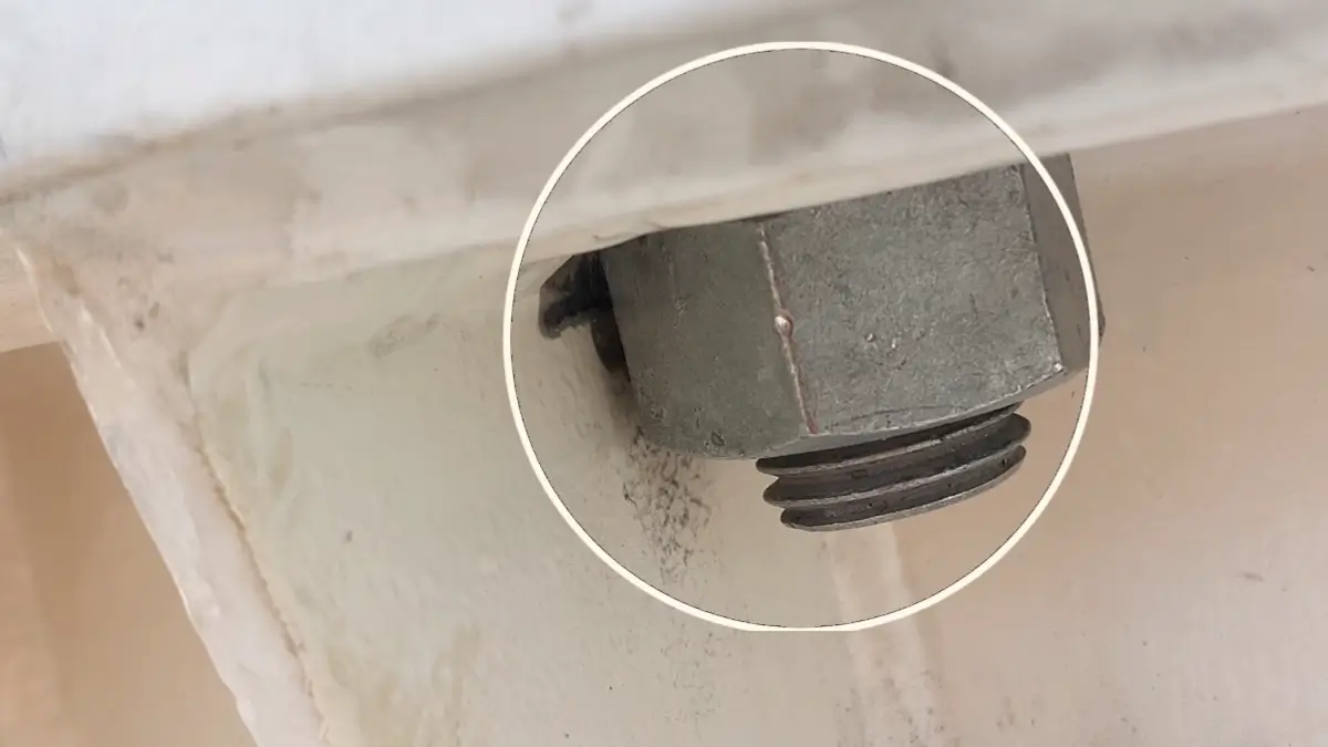 Motor mounting bolts with restricted clearance during laser alignment.