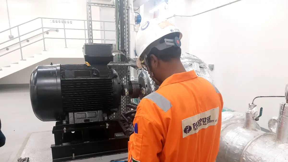Pump to motor alignment being performed on a chiller pump using laser alignment equipment