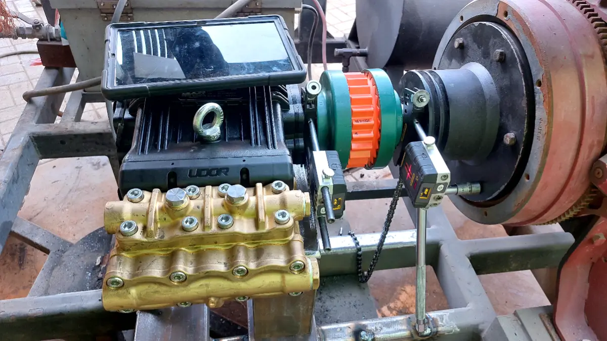 Pump alignment being performed using a laser shaft alignment system and measurement display